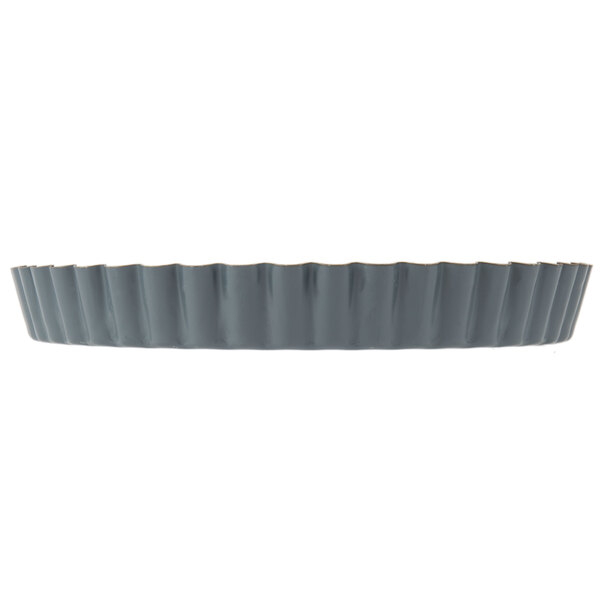 A Matfer Bourgeat fluted non-stick tart pan with a removable bottom.