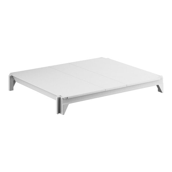 A white Cambro Camshelving Premium kit with solid shelves.