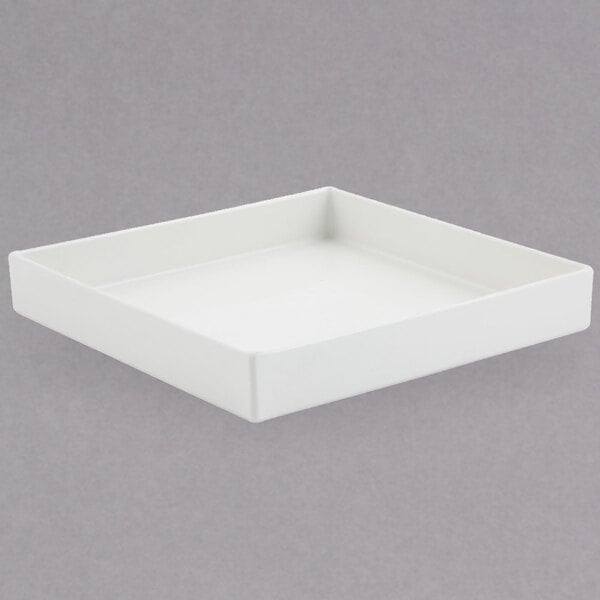 A white square Bon Chef bowl with a sandstone finish on a white surface.