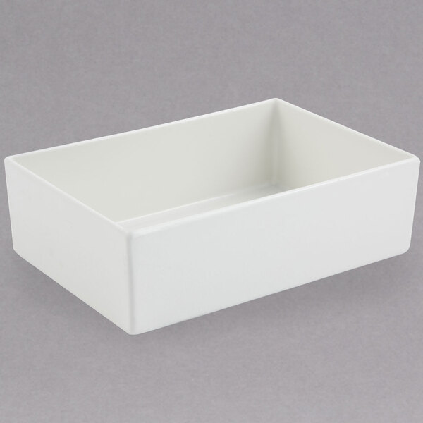 A white rectangular Bon Chef bowl with a sandstone finish.