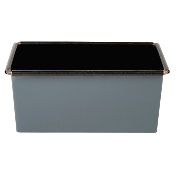 A black rectangular metal loaf pan with a black rim.