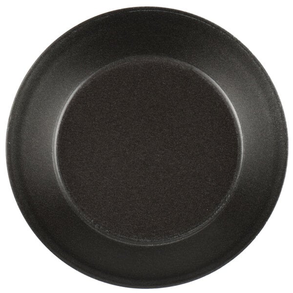 A Matfer Bourgeat non-stick tartlet mold with a round center on a white background.