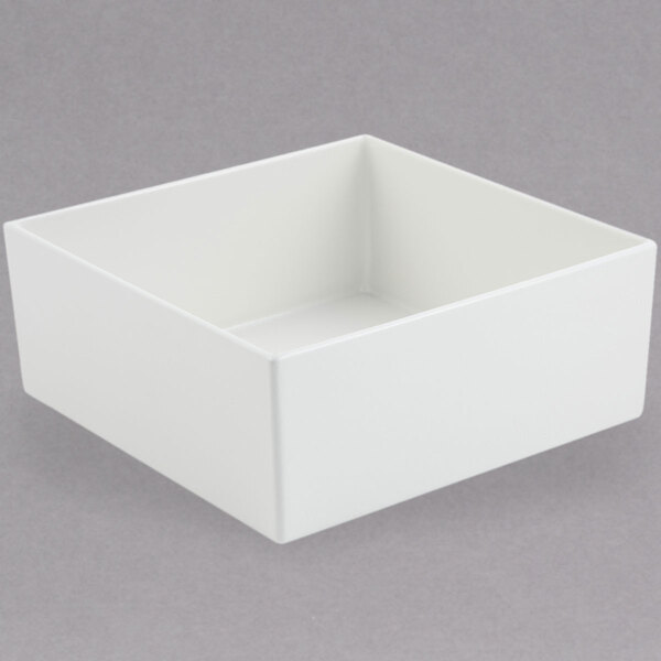 A white square Bon Chef bowl on a white surface