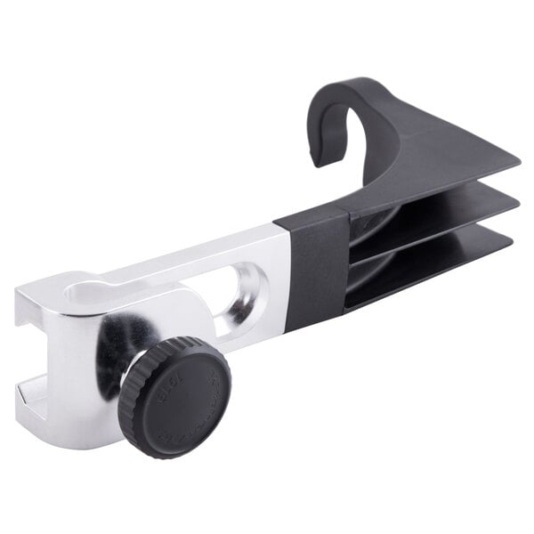 A close-up of a silver and black KitchenAid immersion blender with a black wheel.