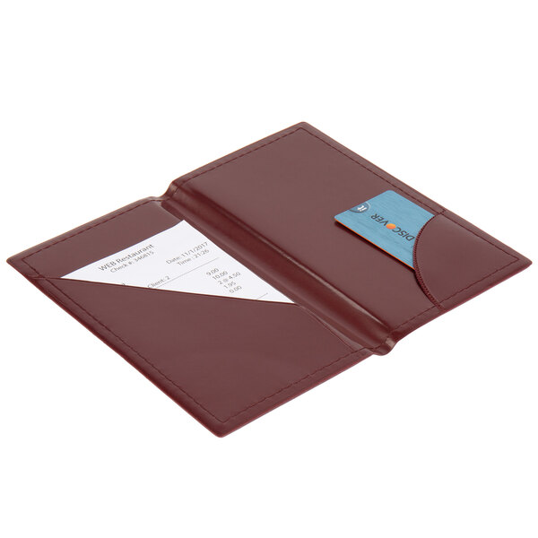 A burgundy leather Guest Check Presenter with a bill inside.