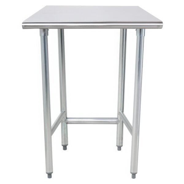 An Advance Tabco stainless steel work table with an open base and metal legs.