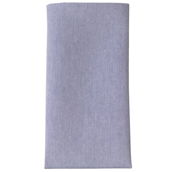 A close up of a blue chambray cloth napkin.