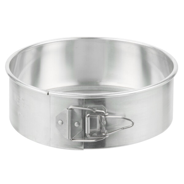 a round metal pan with a clip