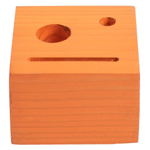 A brown customizable mandarin wood block with a hole in it.
