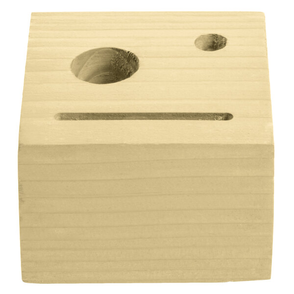 A natural wood block check presenter with a carved circle in the front.