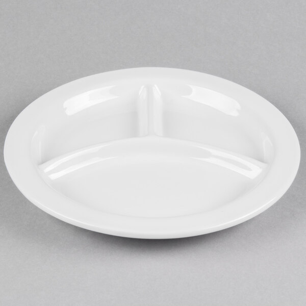 A close up of a Tuxton bright white china plate with three sections.