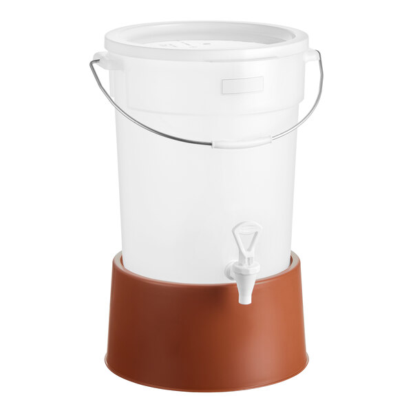A round 6-gallon translucent beverage dispenser with a white body, spigot, and a brown base.