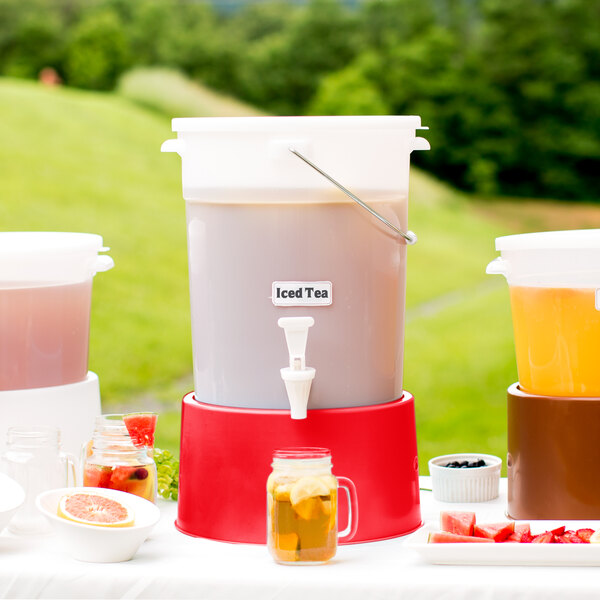 A Choice white plastic beverage dispenser with a red base on a white table.