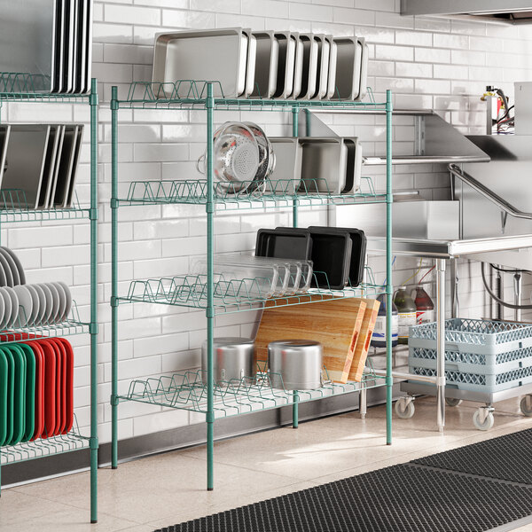 A white rectangular Regency wire drying rack with green epoxy shelves.