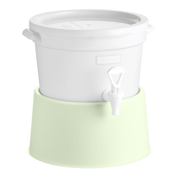 A round 3-gallon white beverage dispenser with a spigot and a light green cucumber-colored base.