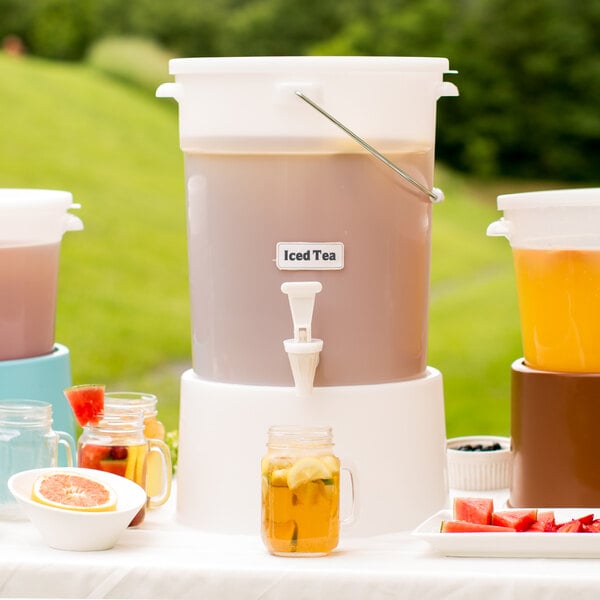 A white Choice beverage dispenser filled with fruit and drinks.