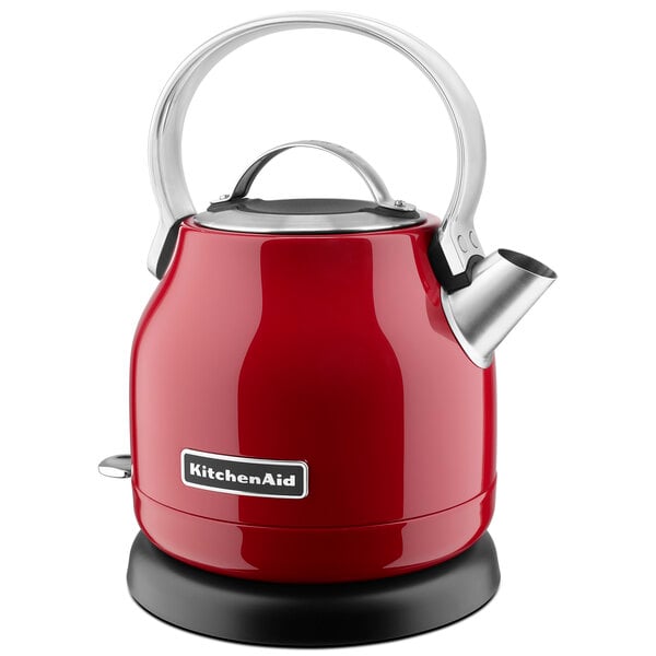 A red KitchenAid electric kettle with a silver handle.