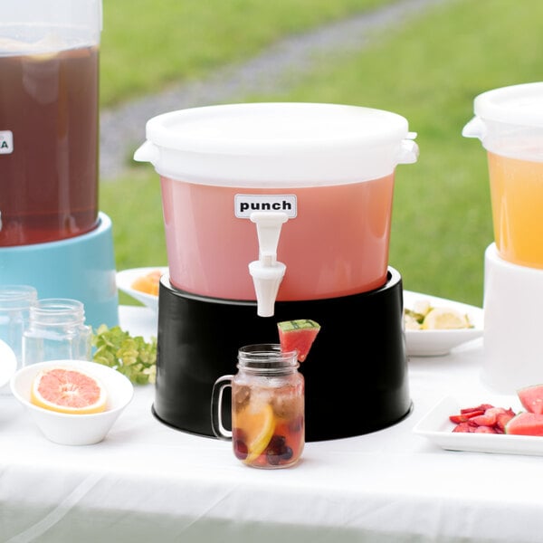 A white Choice beverage dispenser with a black base on a table with drinks.
