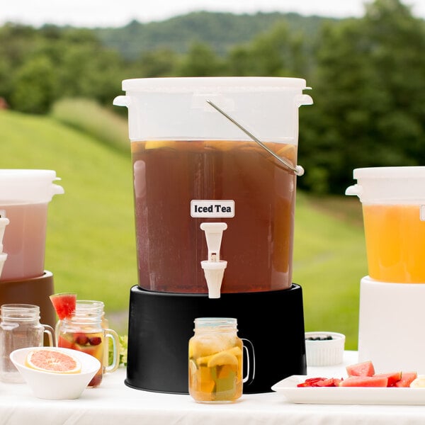 A Choice translucent beverage dispenser filled with fruit and drinks.