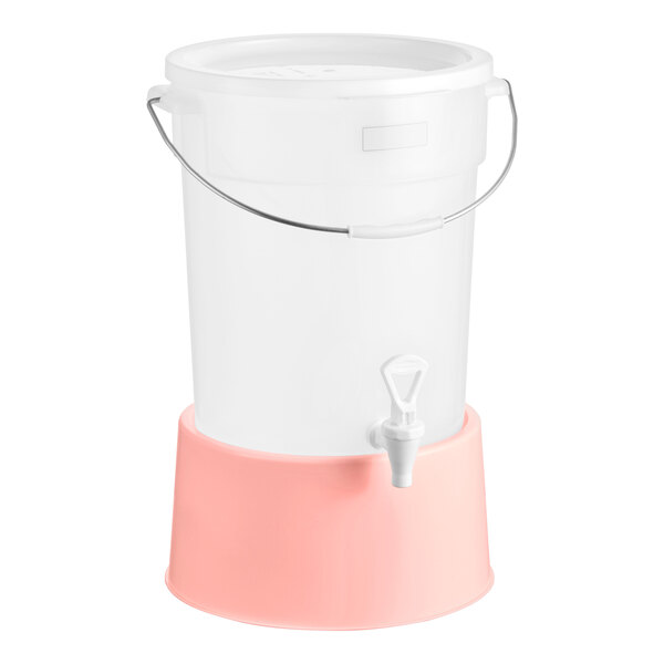 A round 6-gallon translucent beverage dispenser with a rose-colored base and a spigot.