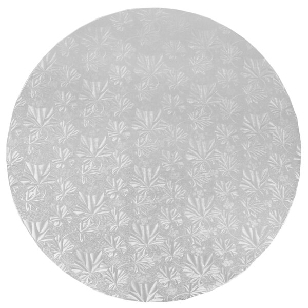 A white round Enjay cake drum with a pattern.