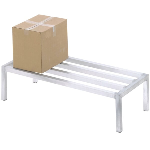 A cardboard box on a Channel heavy-duty metal dunnage rack.