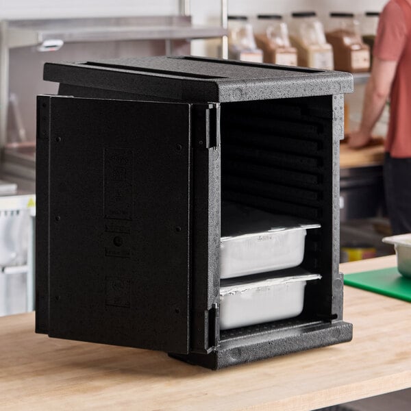 A black front-loading insulated food pan carrier designed to hold up to six full-size pans.