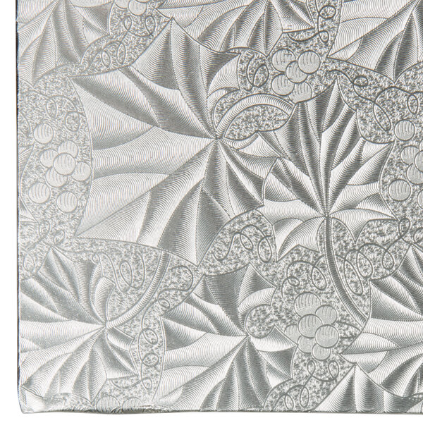 A silver Enjay square cake drum with a white background.