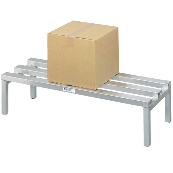 A Channel heavy-duty aluminum dunnage rack with a box on it.