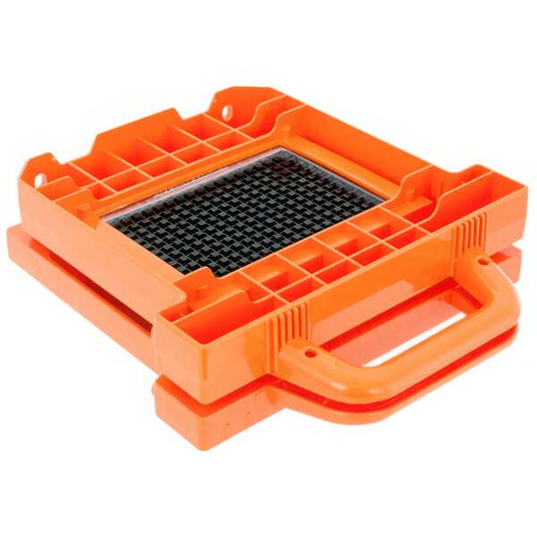 An orange plastic tool box with a black grid containing an orange and black dicer blade and pusher head assembly.