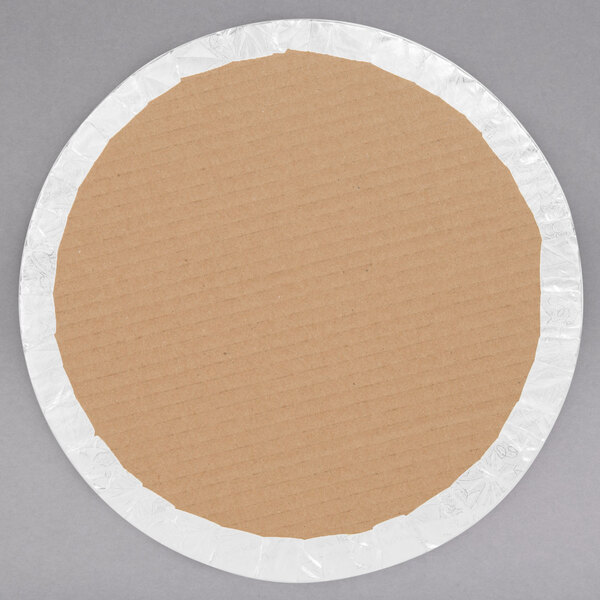 A circular cardboard plate with a white rim.