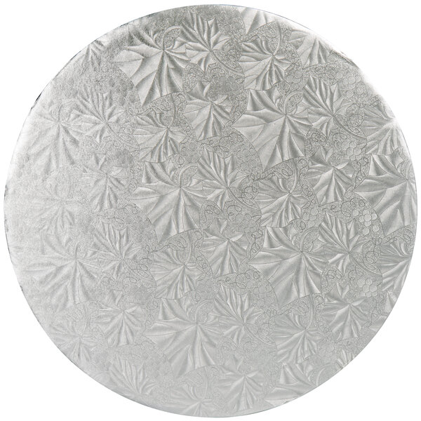 A circular silver surface with a pattern.