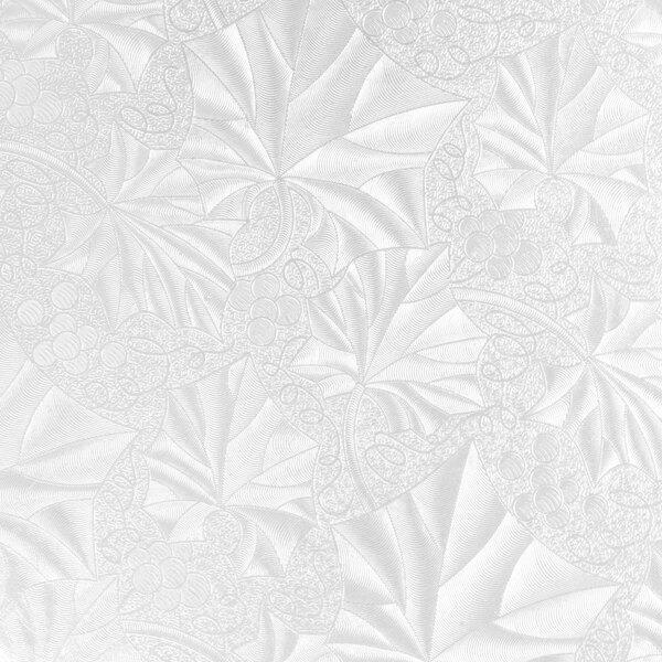 A white surface with a pattern of leaves.