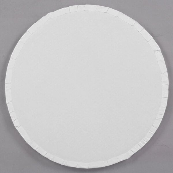 A white round Enjay cake drum with a white edge.