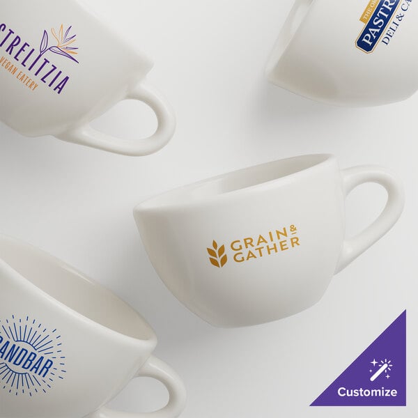 A group of four white Acopa stoneware coffee cups with logos.
