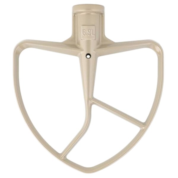 A beige KitchenAid mixer flat beater attachment with a white square on it.