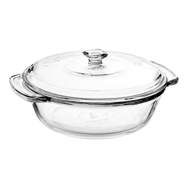 An Anchor Hocking clear glass round cake pan with a lid.