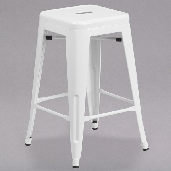 A white Flash Furniture backless stool with a metal base and square drain seat.