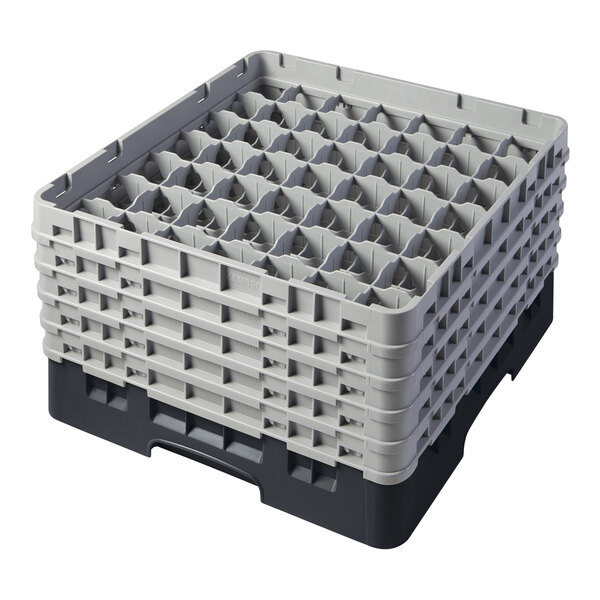 A black plastic Cambro glass rack with many small compartments.