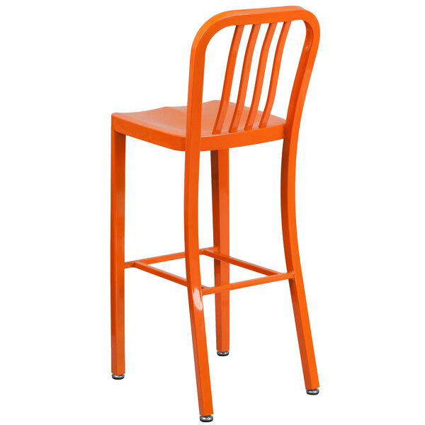 An orange metal bar stool with a vertical slat back.