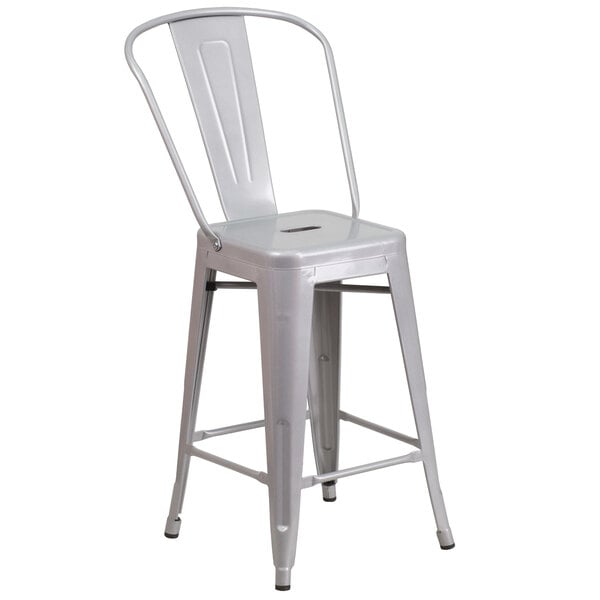 A silver metal outdoor restaurant bar stool with a vertical slat back.