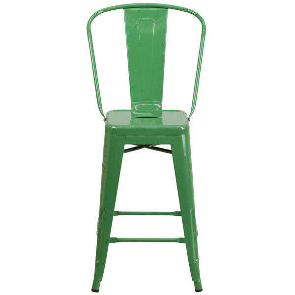 A green metal counter height stool with a vertical slat back.