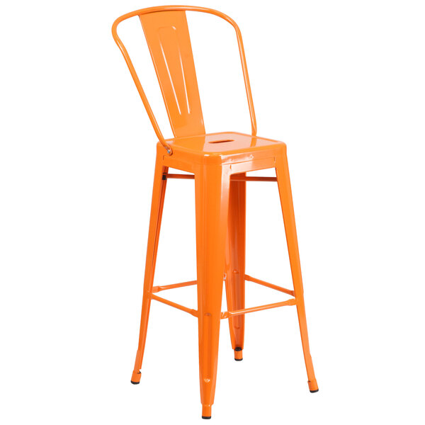 An orange Flash Furniture bar stool with a backrest and seat with a drain hole.