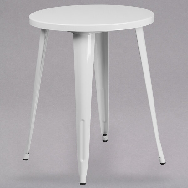 A Flash Furniture white metal round cafe table with two legs.