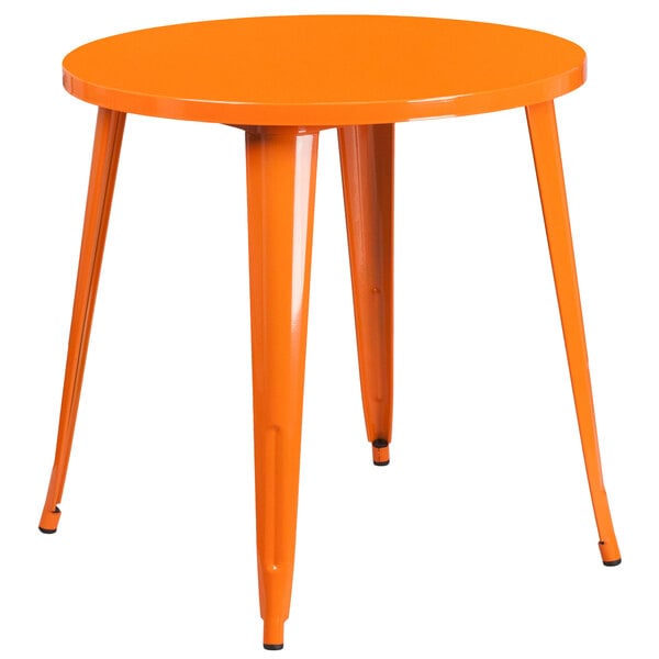 An orange Flash Furniture metal round cafe table with legs.