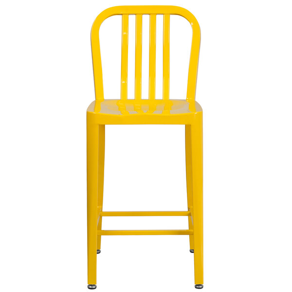 A yellow metal indoor/outdoor counter height stool with a vertical slat back.