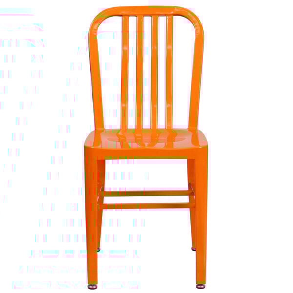 An orange metal chair with a vertical slat back.