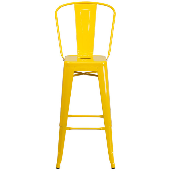 A Flash Furniture yellow galvanized steel bar stool with backrest and drain hole seat.
