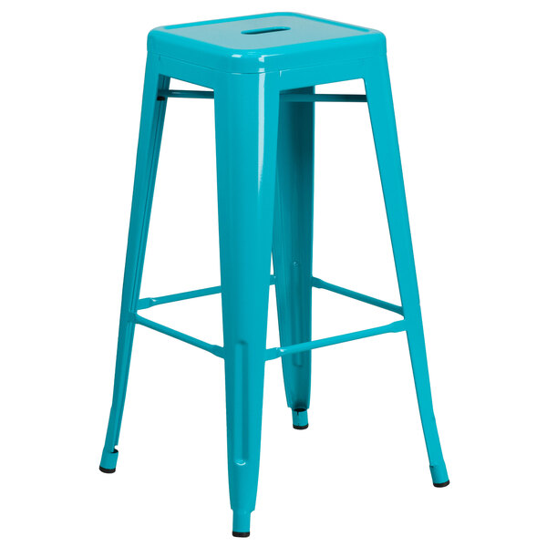 A teal blue metal backless bar stool with a square seat.