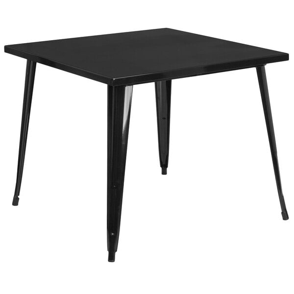 A Flash Furniture black metal square table with legs.